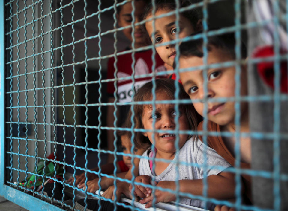 Image: Palestinian children, who fled their homes amid Israeli airstrikes, take refuge at a United Nations-run school in Gaza City (Suhaib Salem / Reuters)
