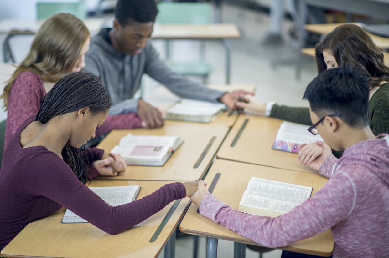 Would religious charter schools be constitutional? More advocates are pushing to find out. <a href="https://www.gettyimages.com/detail/photo/praying-together-in-a-bible-study-royalty-free-image/505827292?phrase=god%20school&adppopup=true" rel="nofollow noopener" target="_blank" data-ylk="slk:FatCamera/E+ via Getty Images;elm:context_link;itc:0;sec:content-canvas" class="link ">FatCamera/E+ via Getty Images</a>