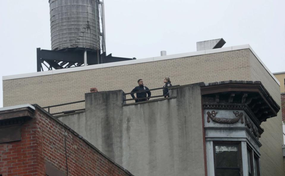 It wasn’t clear whether the woman fell from the roof of the building. G.N.Miller/NYPost