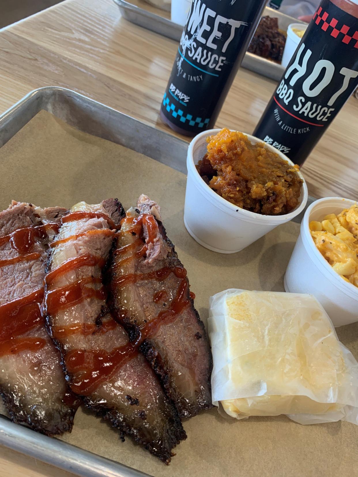 A brisket platter at BB Rad's Coastal BBQ in Titusville includes cornbread and two sides, in this case, sweet potato casserole and and mac and cheese.