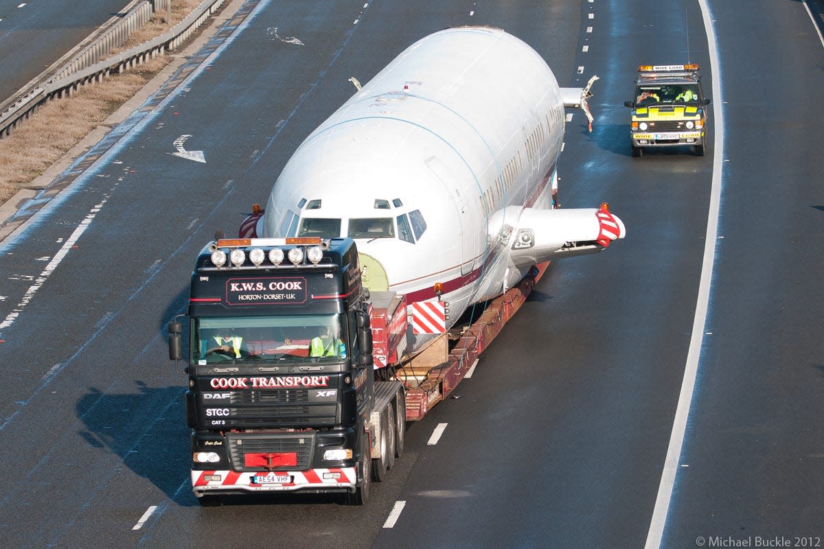 The aircraft moving down the motorway.