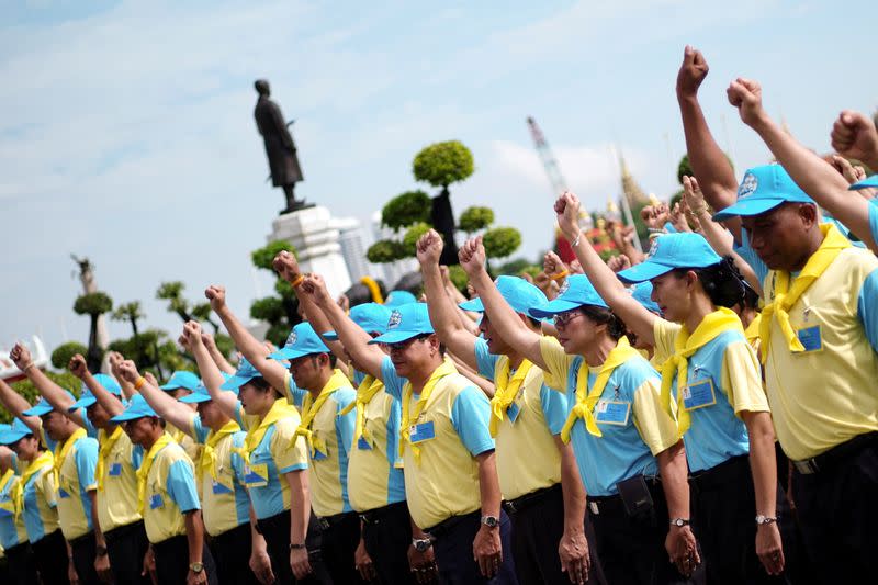 FILE PHOTO: Thai royal volunteers prepare to do painting and gardening work at the Temple of Dawn in Thonburi, Bangkok, Thailand