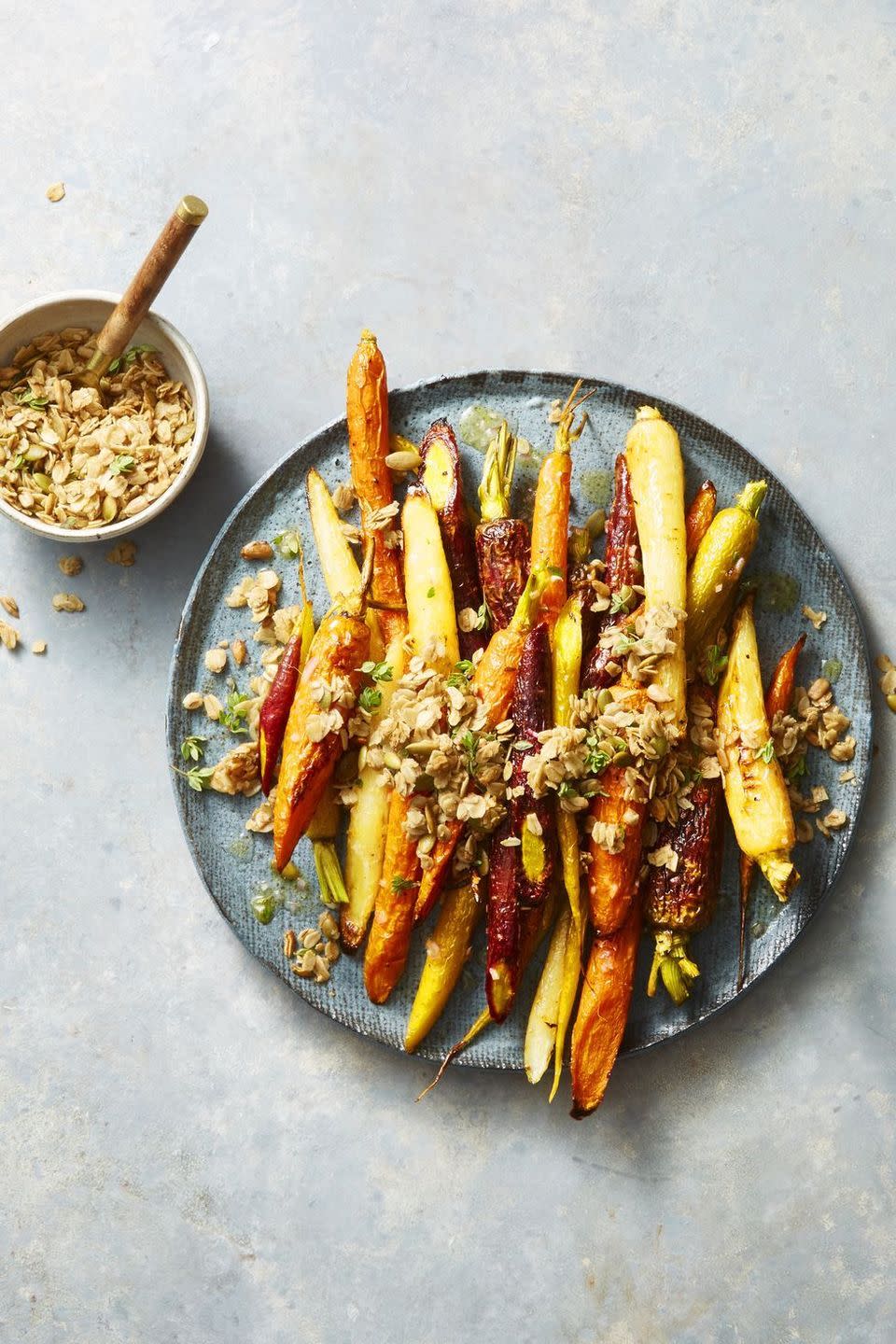 <p>For an unexpected side, top sweet roasted carrots with spiced, crunchy oats.</p><p><em><a href="https://www.goodhousekeeping.com/food-recipes/easy/a22750582/roasted-carrots-with-cumin-thyme-granola-recipe/" rel="nofollow noopener" target="_blank" data-ylk="slk:Get the recipe for Roasted Carrots with Cumin-Thyme Granola »;elm:context_link;itc:0;sec:content-canvas" class="link ">Get the recipe for Roasted Carrots with Cumin-Thyme Granola »</a></em></p>