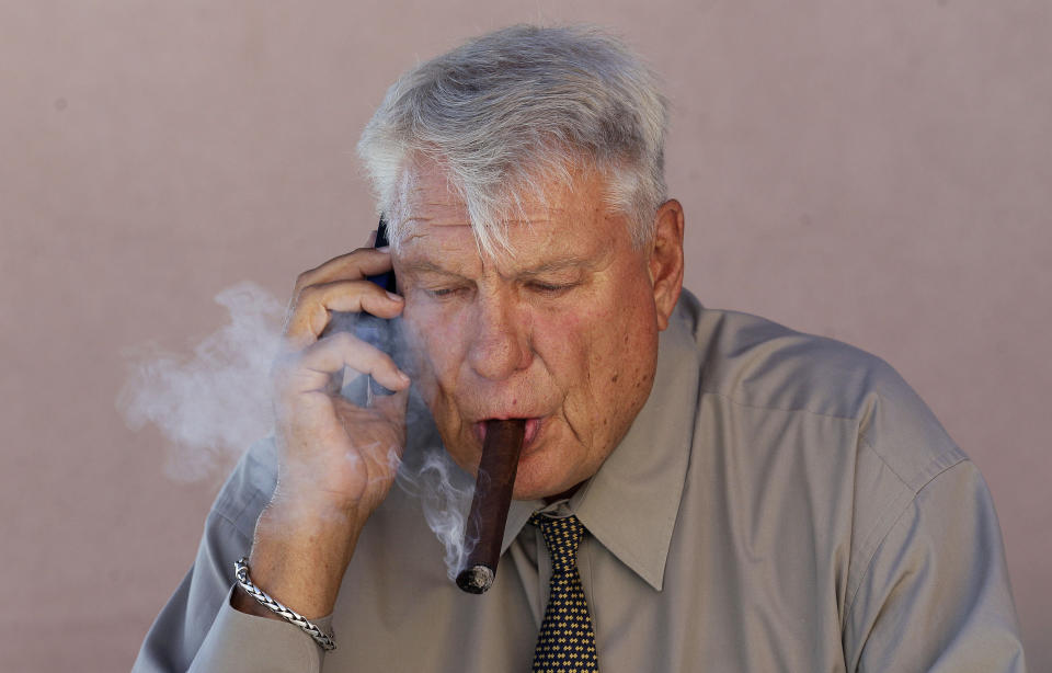 Don Nelson’s smoking habits have evidently changed a bit since this photo was taken in August of 2012. (AP)