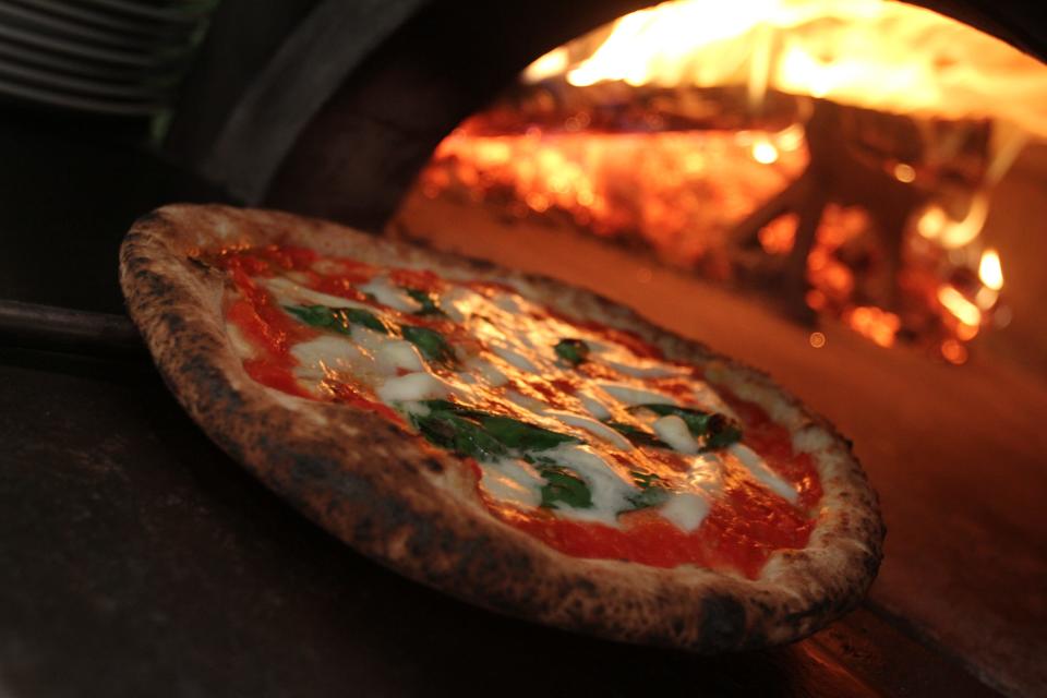 The Margherita Pizza coming out of the wood-fired oven at Figidini in Providence.