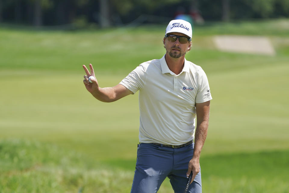 Roger Sloan acknowledges the crowd after making a birdie on the sixth hole during the third round of the 3M Open golf tournament in Blaine, Minn., Saturday, July 24, 2021. (AP Photo/Craig Lassig)