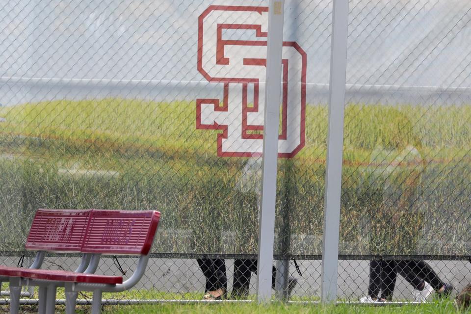 Jurors walk around the “1200 building,” the crime scene where the 2018 shootings took place, at Marjory Stoneman Douglas High School in Parkland on Thursday, August 4, 2022. This during the penalty phase in the trial of confessed shooter Nikolas Cruz who previously plead guilty to all 17 counts of premeditated murder and 17 counts of attempted murder. Cruz waived his right to be present at the viewing.