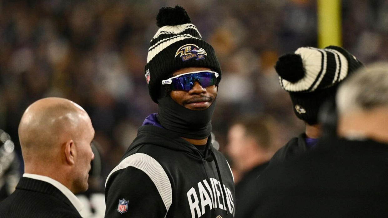 Baltimore Ravens NFL quarterback Lamar Jackson looks on from the sideline during the home finale against the Pittsburgh Steelers