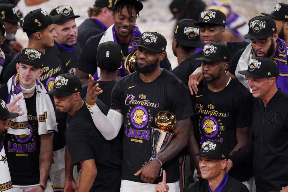 LeBron James celebrates with his teammates after the Lakers defeated the Miami Heat 106-93 in Game 6 of the NBA Finals on Sunday night. (AP Photo/Mark J. Terrill)