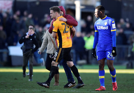 Soccer Football - FA Cup Third Round - Newport County AFC vs Leeds United - Rodney Parade, Newport, Britain - January 7, 2018 Newport County's Mickey Demetriou celebrates while Leeds United's Hadi Sacko looks on after the match REUTERS/Rebecca Naden