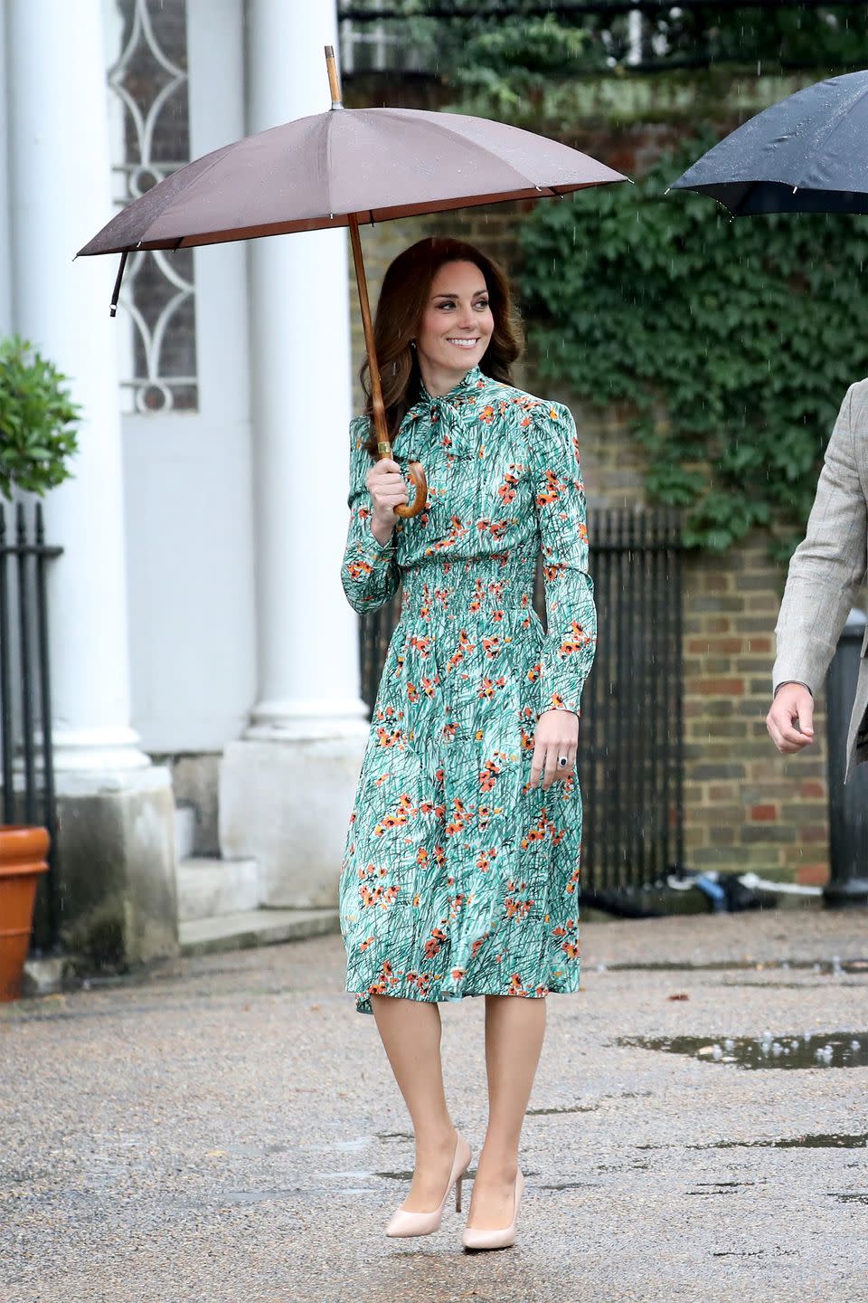 <p>The Duchess wears a Poppy-print floral pussybow dress by Prada with nude pumps during a rainy visit to the White Garden at Kensington Palace, which is now dedicated to Princess Diana. <a class="link " href="https://go.redirectingat.com?id=74968X1596630&url=http%3A%2F%2Fwww.matchesfashion.com%2Fus%2Fproducts%2F1154375&sref=https%3A%2F%2Fwww.harpersbazaar.com%2Ffashion%2Ftrends%2Fg1811%2Fkate-middleton-outfits%2F" rel="nofollow noopener" target="_blank" data-ylk="slk:SHOP;elm:context_link;itc:0;sec:content-canvas">SHOP</a></p>