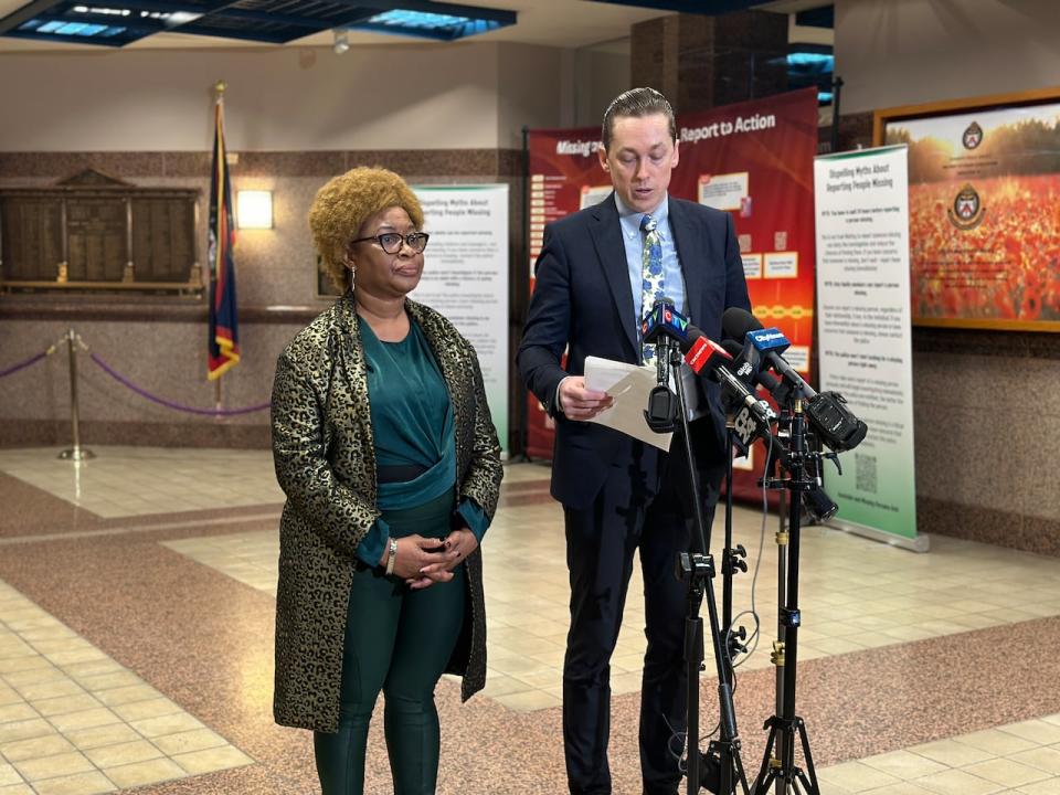 Christine Stought-O'Gilvie, mother of Hasani O'Gilvie, and the family's lawyer speak to reporters at Toronto police headquarters on Tuesday.