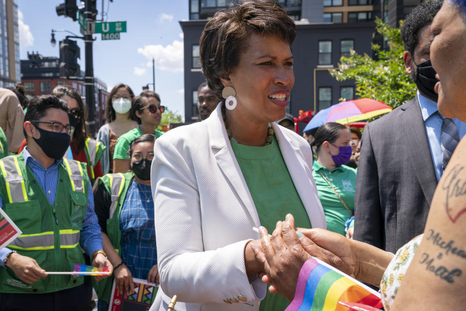 District of Columbia Mayor Muriel Bowser, center, speaks with constituents, Friday, June 10, 2022, in Washington. Bowser is seeking a third term in office. (AP Photo/Jacquelyn Martin)