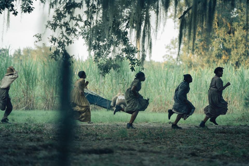 Five enslaved persons running beneath willow branches