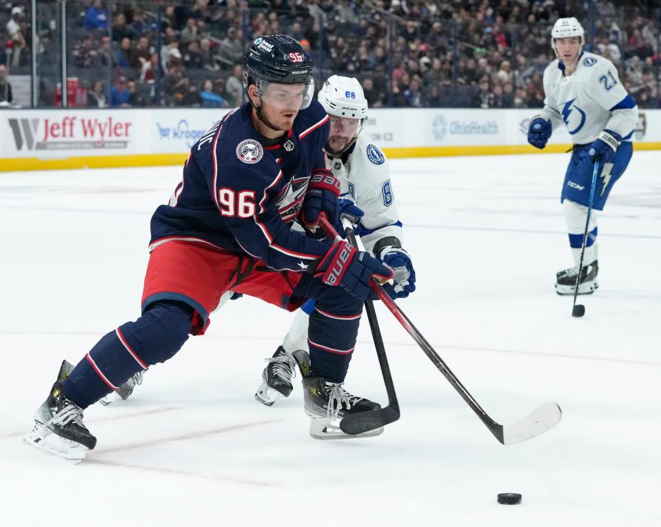 Feb. 10, 2024; Columbus, Ohio, USA; 
Columbus Blue Jackets center Jack Roslovic (96) is defended by Tampa Bay Lightning right wing Nikita Kucherov (86) during the third period of a hockey game at Nationwide Arena on Saturday.
