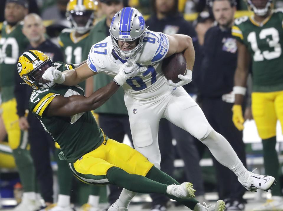 Packers safety Rudy Ford against Lions tight end Sam LaPorta during the Lions' 34-20 win on Thursday, Sept. 28, 2023, in Green Bay, Wisconsin.