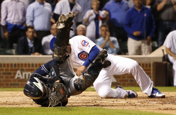 Anthony Rizzo was not fined or suspended for running into Austin Hedges. (AP Photo)