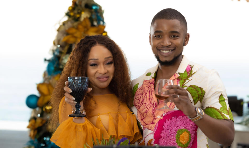 Two people raising their glasses in a toast