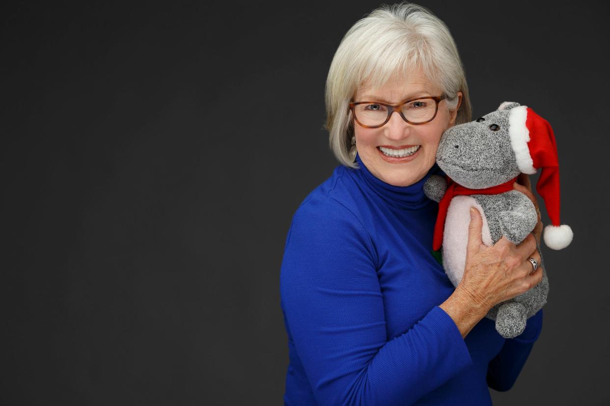 “I Want a Hippopotamus for Christmas” singer Gayla Peevey poses with a plush hippo.