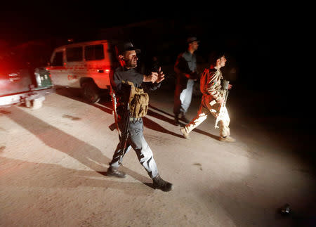 Afghan policemen stand guard at the site of an attack at American University of Afghanistan in Kabul, Afghanistan August 24, 2016. REUTERS/Omar Sobhani