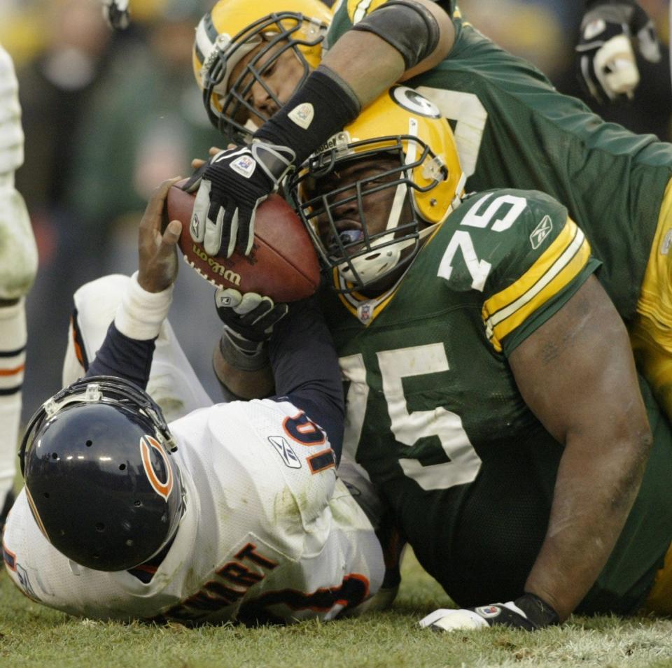 Chicago Bears Kordell Stewart is stuffed by Green Bay Packers Grady Jackson (75) and Nick Barnett on fourth down during the fourth quarter of their game Sunday, December 7, 2003 at Lambeau Field.