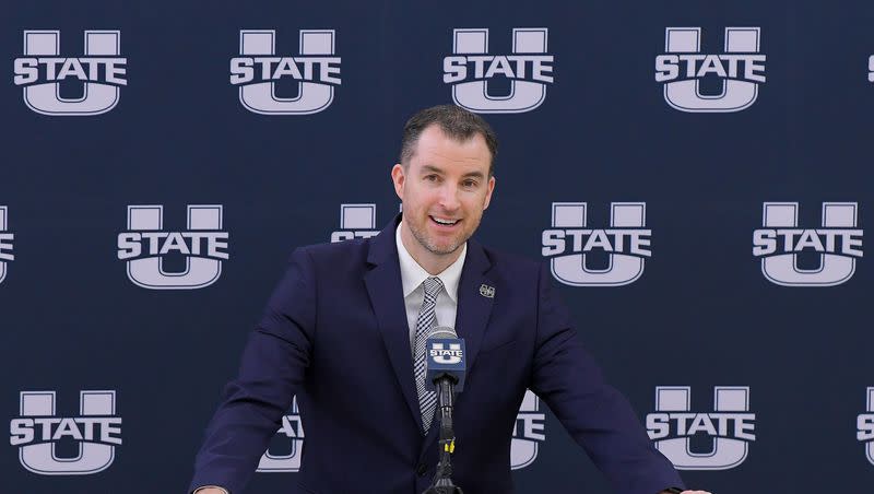 Danny Sprinkle speaks at a press conference where he was introduced as the new basketball coach at Utah State University in Logan on Monday, April 10, 2023.