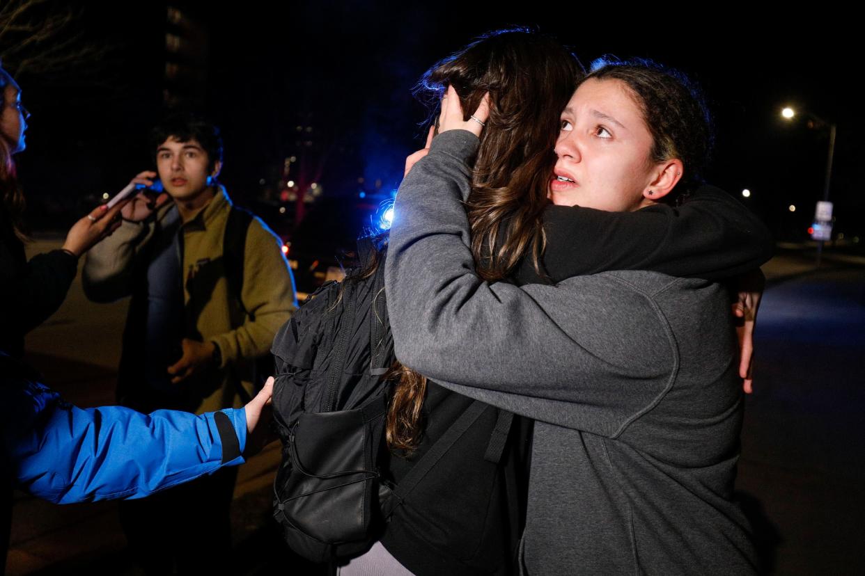 Michigan State University students hug during an active shooter situation on campus on 13 February 2023 in Lansing, Michigan (Getty Images)