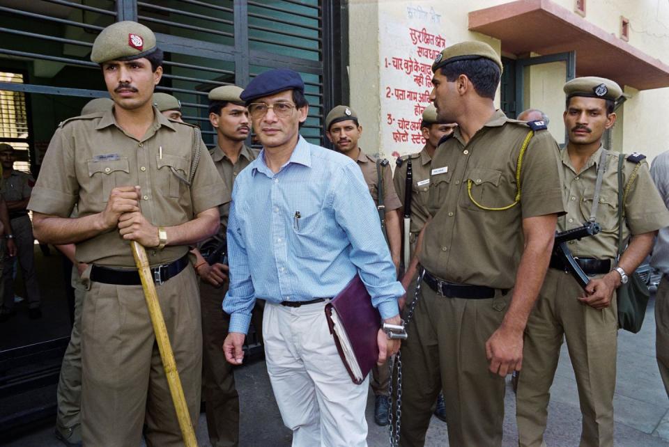 charles sobhraj is escorted by police to a new delhi court on 12 april 1994