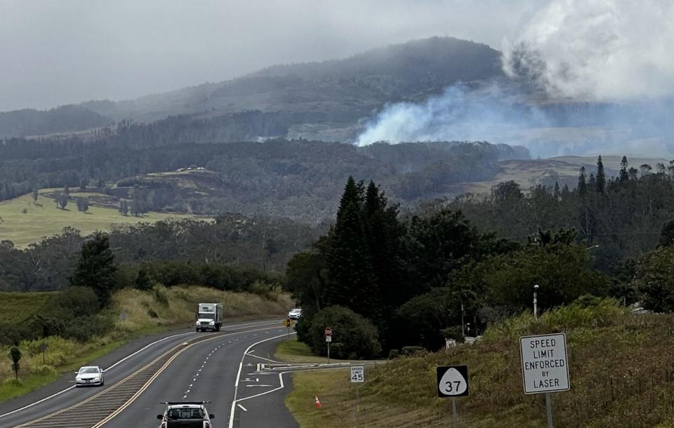 PHOTO: Smoke is seen on a mountain in Lahaina. (Becky Worley/ABC News)