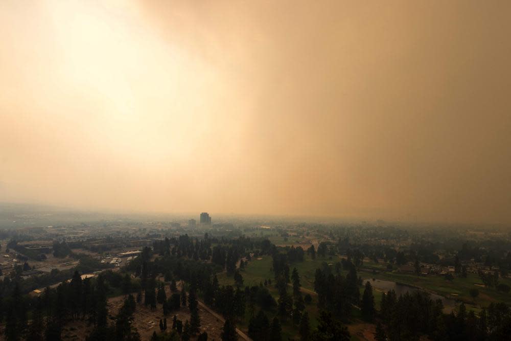Smoke from the McDougall Creek wildfire envelops Kelowna, British Columbia, on 18 August.
