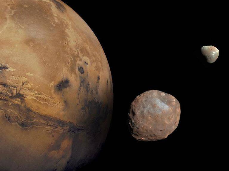 Mars is accompanied by an inner moon named Phobos and an outer moon named Deimos. (NASA)