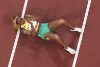 Elaine Thompson-Herah, of Jamaica, wins the gold during the finals of the women's 100-meter at the 2020 Summer Olympics, Saturday, July 31, 2021, in Tokyo. (AP Photo/Morry Gash)