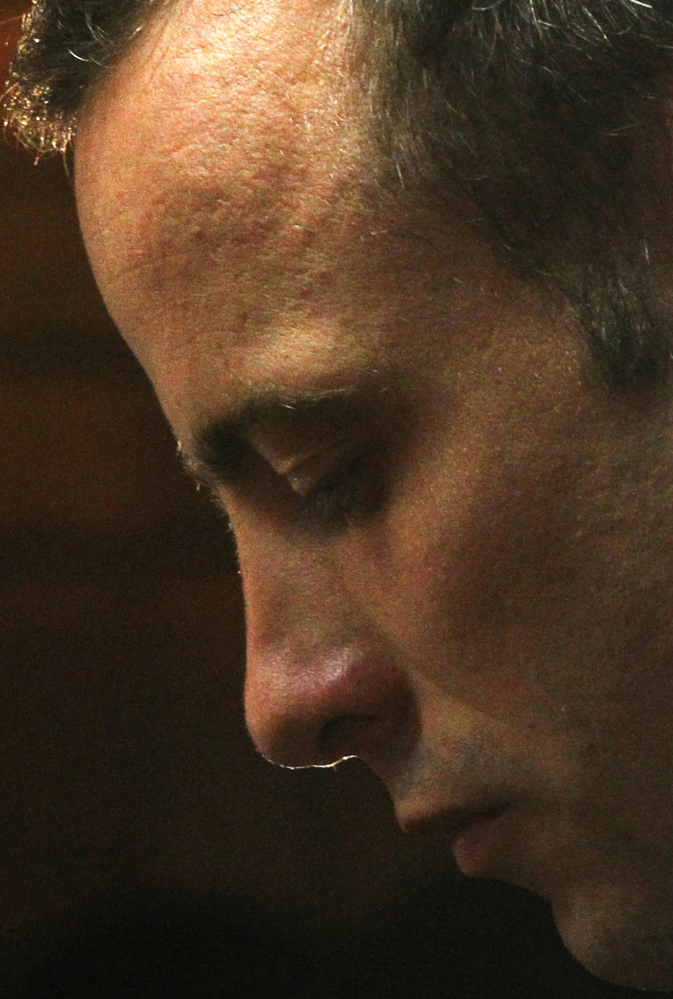 FILE - in this Friday, Feb. 22, 2013 file photo, Olympic athlete Oscar Pistorius stands in the dock during his bail hearing at the magistrate court in Pretoria, South Africa. With his athletic triumphs tarnished by the killing of his girlfriend, Reeva Steenkamp. Pistorius, now 27, faces possibly being sent to prison until he is older than 50. Pistorius goes on trial Monday March 3, 2014. (AP Photo/Themba Hadebe, File)