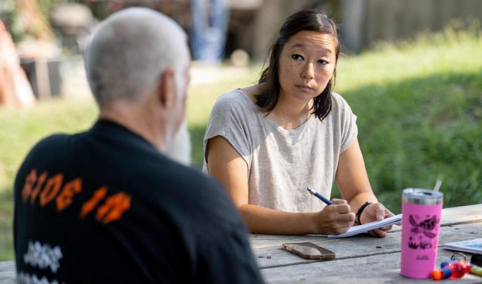 Katie Moore, an enterprise and accountability reporter at The Star, interviews a man in a small Missouri town for an upcoming project.