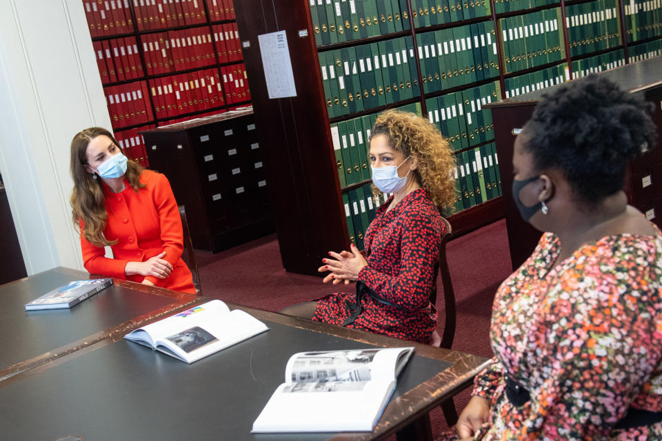 LONDON, ENGLAND - MAY 07: Catherine, Duchess of Cambridge talks to 'Hold Still' entrants Naz Maleknia (centre) and Claudia Burton (right) during a visit to the archive in the National Portrait Gallery in central London to mark the publication of the 'Hold Still' book on May 7, 2021 in London, England. (Photo by Dominic Lipinski - WPA Pool/Getty Images)