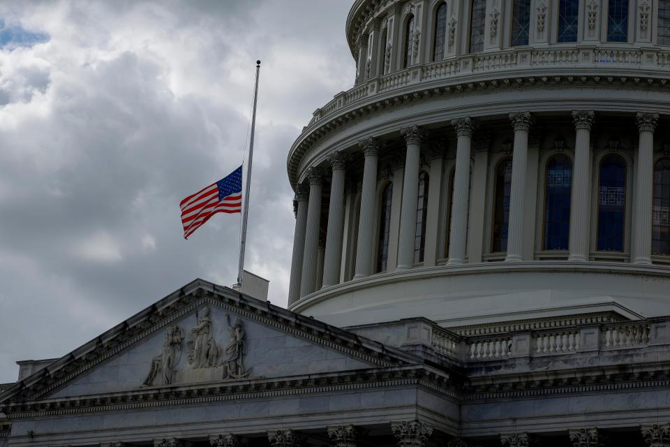 The flag above the U.S. Capitol is brought to half-staff on September 08, 2022 in honor of Queen Elizabeth II.