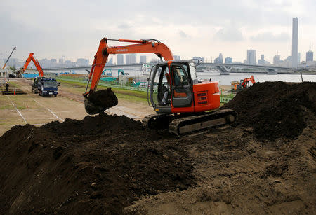 FILE PHOTO: Excavators are seen at a construction site in Tokyo, Japan June 8, 2016. REUTERS/Toru Hanai/File Photo