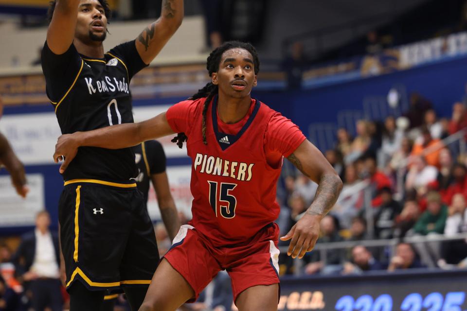 Malone University guard Tahleik Walker looks to rebound during Thursday night’s basketball game against the Kent State GOlden Flashes at the Kent State M.A.C. Center.