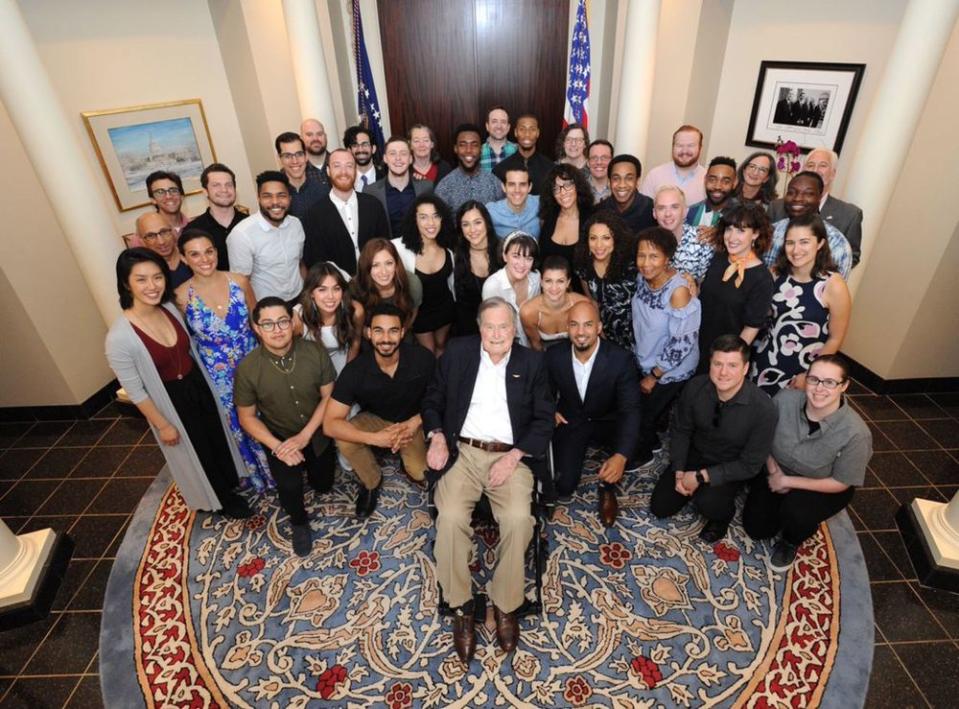 George H.W. Bush (center) and the cast and crew of <em>Hamilton</em>