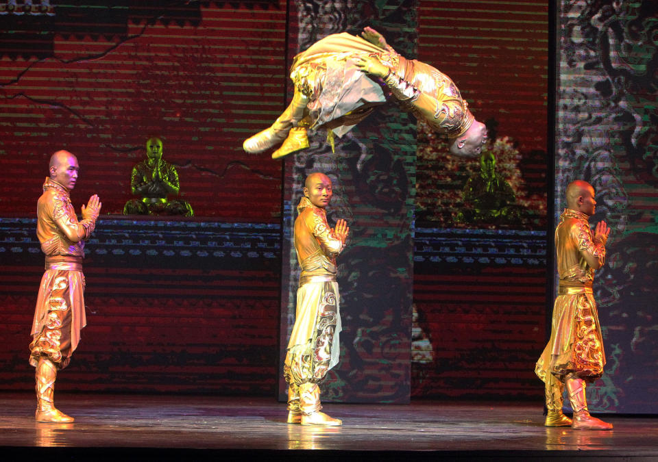 FILE - In this Jan. 3, 2014, file photo, actors perform during a preview of "PANDA!" in the Palazzo Theater at the Palazzo hotel-casino in Las Vegas. “PANDA!” is the first Chinese-produced show to take up residency on the famous tourist corridor. Directed by An Zhou, the man behind the 2008 Beijing Olympics opening and closing ceremonies, “PANDA!” opened to mixed critical reviews in December and recently added dates through July. It follows two Chinese-produced resident shows in Branson, Mo., and a steady flow of touring Chinese arts troupes. (AP Photo/Las Vegas Review-Journal, Jerry Henkel, File)