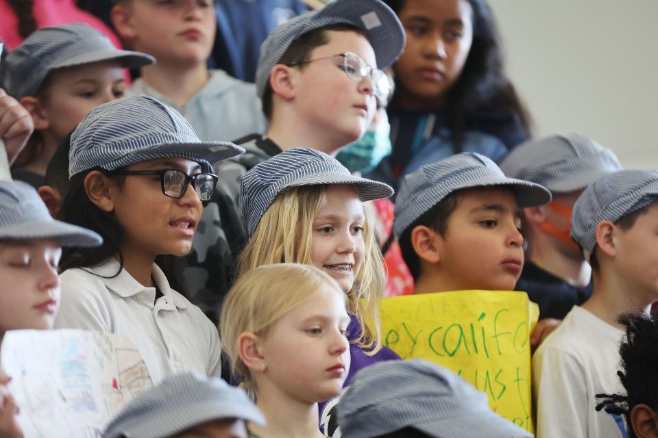 Armstrong Academy fourth grade students wear railroad hats as they kick off the student-led Spikes2Utah letter writing campaign during a press conference at the school in West Valley City on Friday, April 7, 2023. The Golden Spike, the ceremonial final spike driven to join the rails of the transcontinental railroad, is not in Utah but instead housed at the Cantor Arts Center at Stanford University in California. | Jeffrey D. Allred, Deseret News