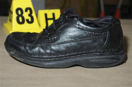 A shoe worn by Adam Lanza is pictured in this evidence photo released by the Connecticut State Police, December 27, 2013. REUTERS/Connecticut State Police/Handout via Reuters