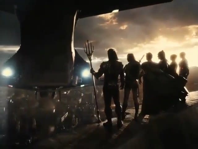 The Justice League standing on top of a nuclear tower with the Flying Fox hovering in front of them in "Zack Snyder's Justice League"