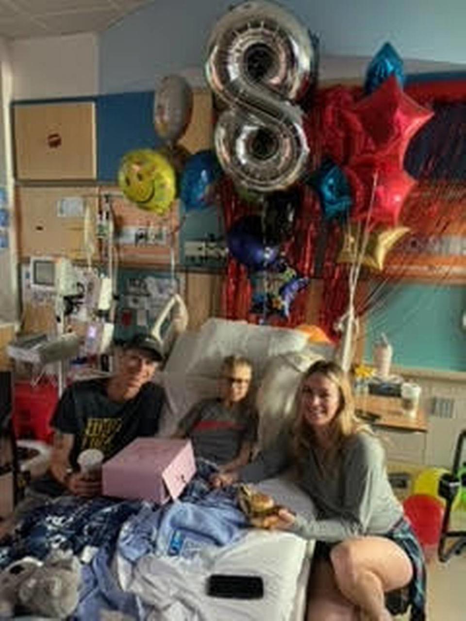 Tristen Graham, 9, and his parents, Tyler, left, and Tiffanie, right, had to stay in the Bay Area for three months last year for Tristen’s bone marrow transplant. COURTESY OF TIFFANIE GRAHAM