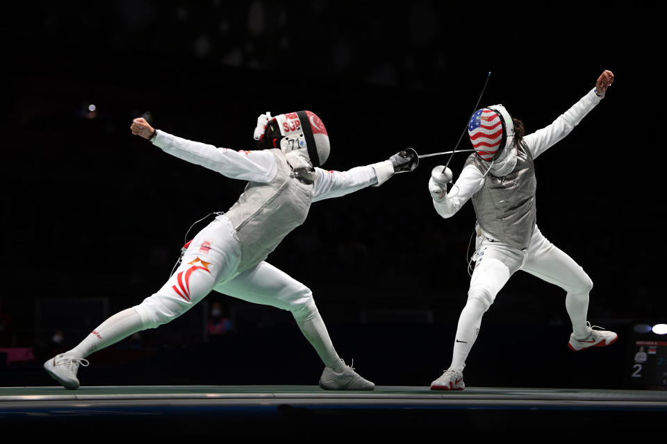 Singapore fencer Amita Berthier (left) competing against Lee Kiefer of the United States in the Tokyo Olympics women's individual foil competition. (