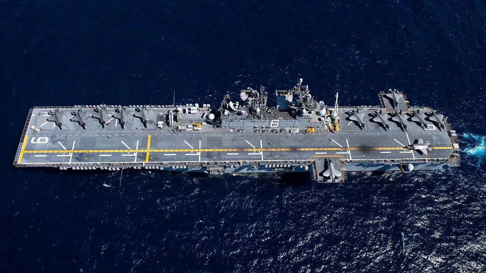 The U.S. Navy amphibious assault ship USS <em>America</em> with 13 U.S. Marine Corps F-35B Joint Strike Fighters on its deck, highlighting its aviation focus. <em>USN</em>