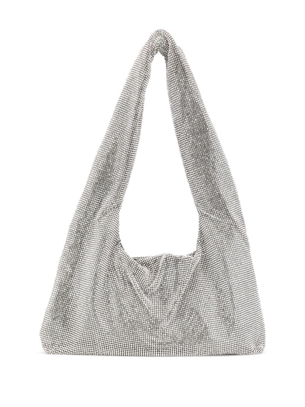 <p><a href="https://go.redirectingat.com?id=74968X1596630&url=https%3A%2F%2Fwww.farfetch.com%2Fshopping%2Fwomen%2Fkara-crystal-mesh-tote-bag-item-15161957.aspx&sref=https%3A%2F%2Fwww.harpersbazaar.com%2Ffashion%2Fdesigners%2Fg43977677%2Faapi-fashion-designers-brands%2F" rel="nofollow noopener" target="_blank" data-ylk="slk:Shop Now;elm:context_link;itc:0;sec:content-canvas" class="link rapid-noclick-resp">Shop Now</a></p><p>Crystal Mesh Tote Bag</p><p>$401.00</p><p>farfetch.com</p><span class="copyright">Farfetch</span>