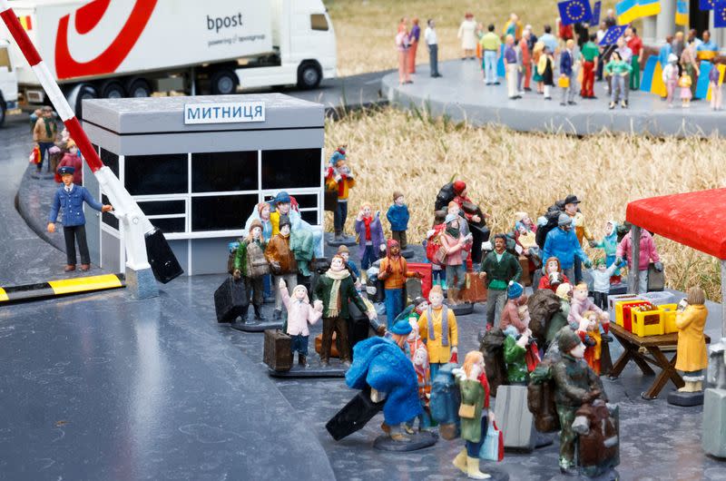 Miniature models depict refugees fleeing Ukraine aid being transported into the country at the "Mini-Europe" theme park in Brussels