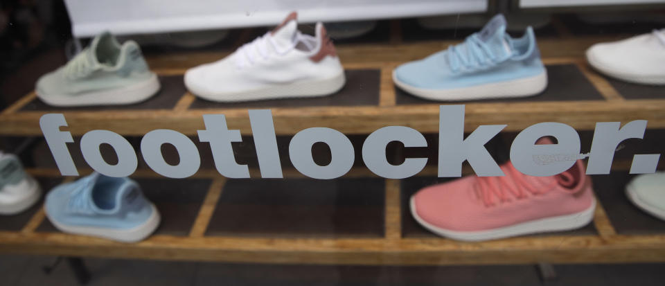 Shoes are displayed at the Foot Locker store in Boston, Friday, Aug. 25, 2017. (AP Photo/Charles Krupa)