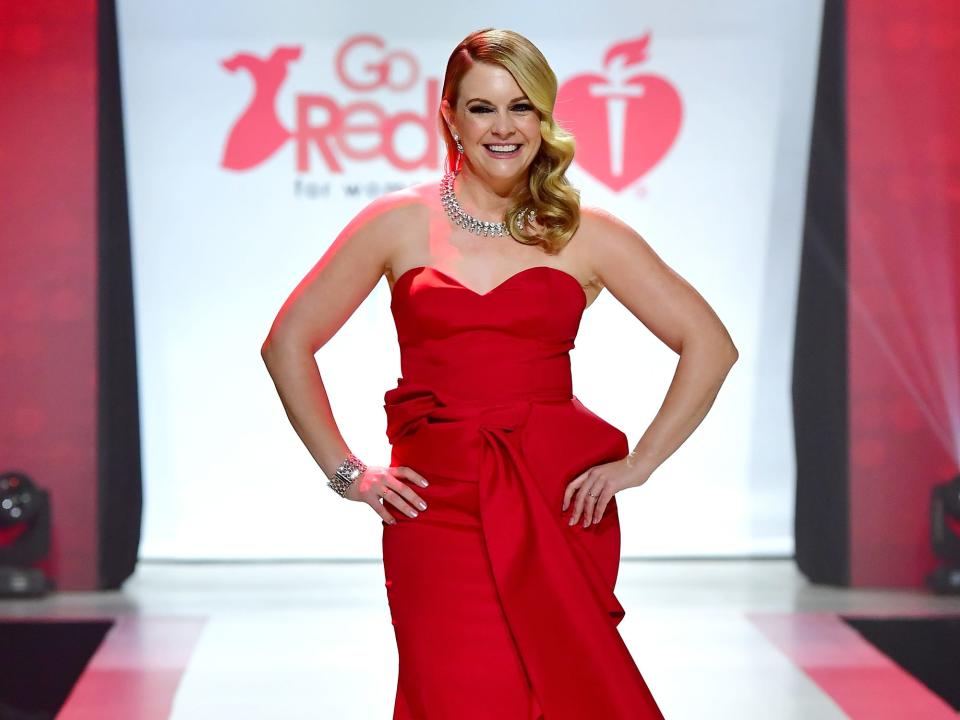 Melissa Joan Hart wearing a red dress.